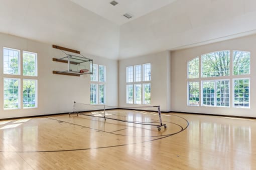 Apartments for Rent in Aurora, IL - Kirkland Crossing - Basketball Court with a Basketball Hoop, High Ceilings, and Large Windows