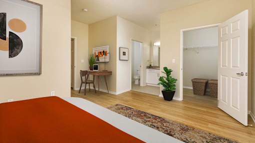 A room with a brown rug and a painting on the wall.