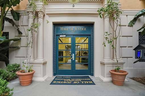 The entrance to a building called Hall of Justice.