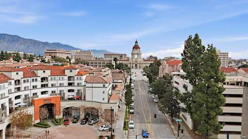 A city street with cars and buildings.