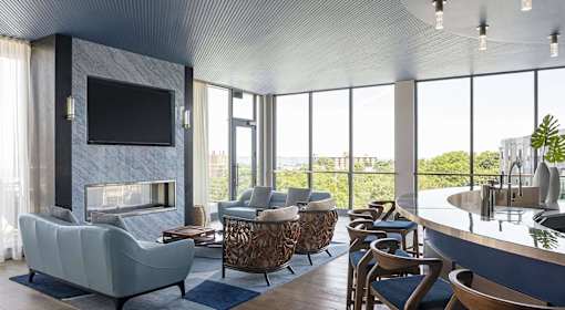 A modern living room with a fireplace and a television.