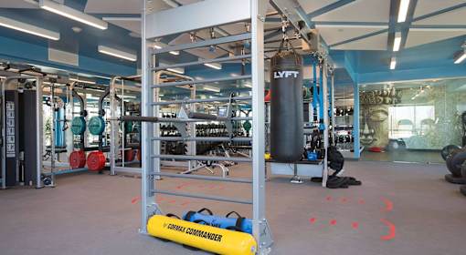 A gym with a punching bag and a sign that says "CIRCLE COMMANDER".