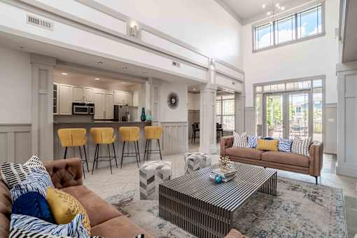 A living room with a brown couch and a coffee table.