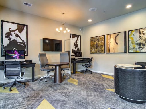 Alpharetta Apartments – The Ascent at Windward – business center with computers and desk chairs
