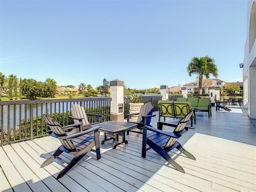 Apartments In Coconut Creek for Rent – Waterview at Coconut Creek – sun deck overviewing lake with seating area
