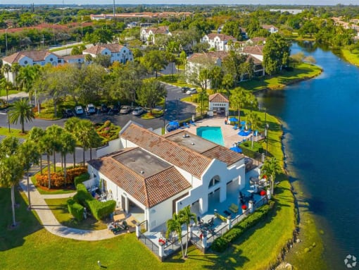Coconut Creek Apartments – Waterview at Coconut Creek – aerial view of clubhouse and pool next to lake