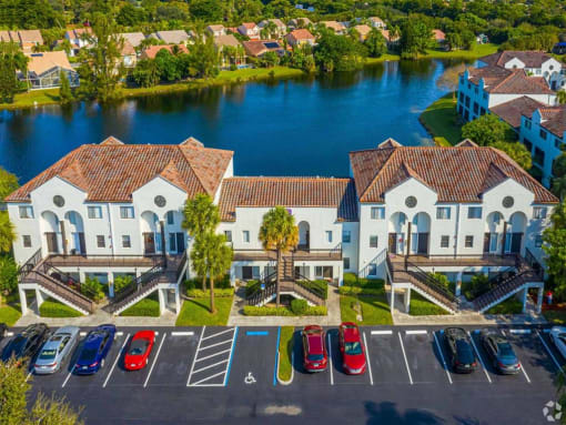 Apartments In Coconut Creek for Rent – Waterview at Coconut Creek – aerial view of community building in front of lake