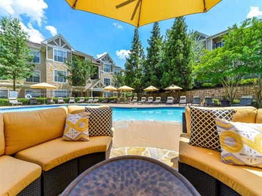 Alpharetta Apartments – The Ascent at Windward – sundeck area with seating and umbrellas