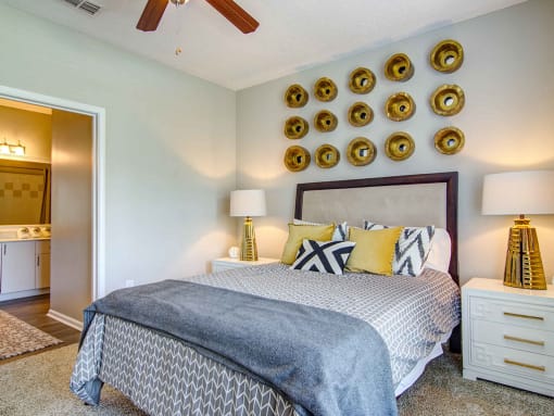 Alpharetta Apartments – The Ascent at Windward – master bedroom with plush carpeting and ceiling fan