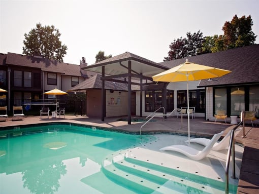 Apartments for Rent - Wilsonville, Oregon - Resort Style Pool with Lounge Chairs and Shaded Areas
