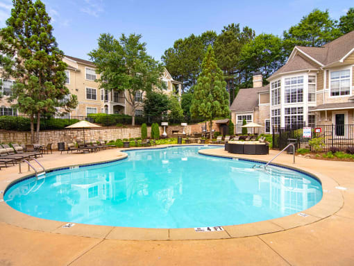 Pet-Friendly Apartments in Alpharetta, GA – The Ascent at Windward – Resort style pool with seating around the sundeck