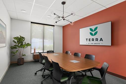 A conference room with a sign that says