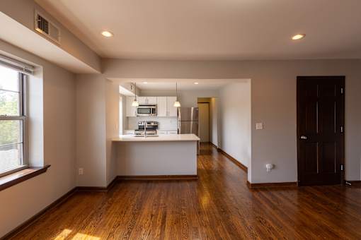 a kitchen and living room in an open floor plan
