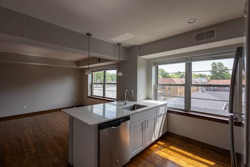 a kitchen with a large window and a sink