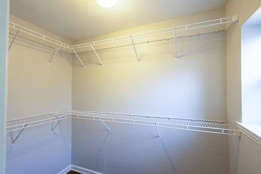 a large walk in closet in a 555 waverly unit
