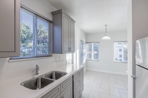 a kitchen with a sink and a window