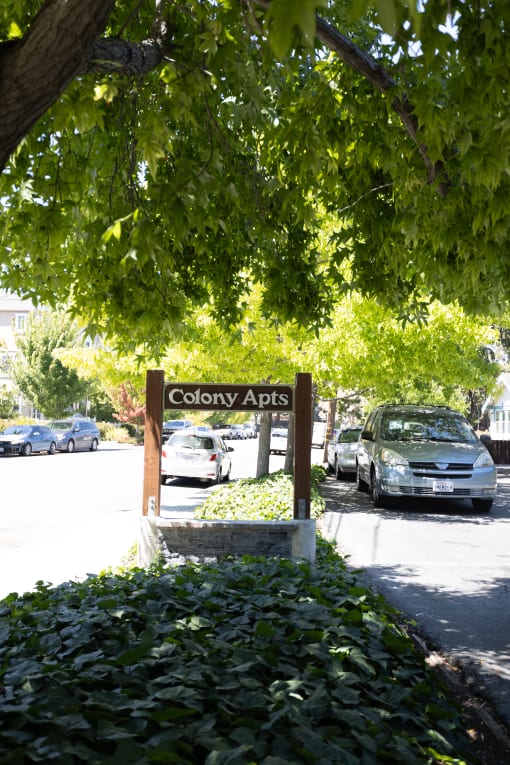 a sign that reads colony apps on the side of a street