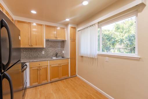 a kitchen with a sink and a window