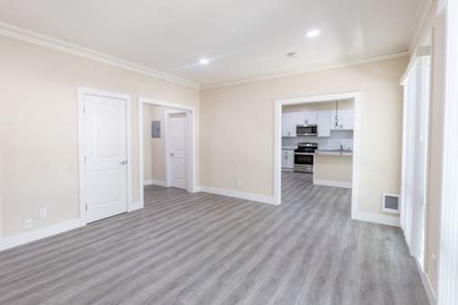 the living room and kitchen of a new home