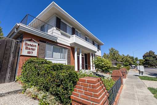 a house with a sign on the side of it