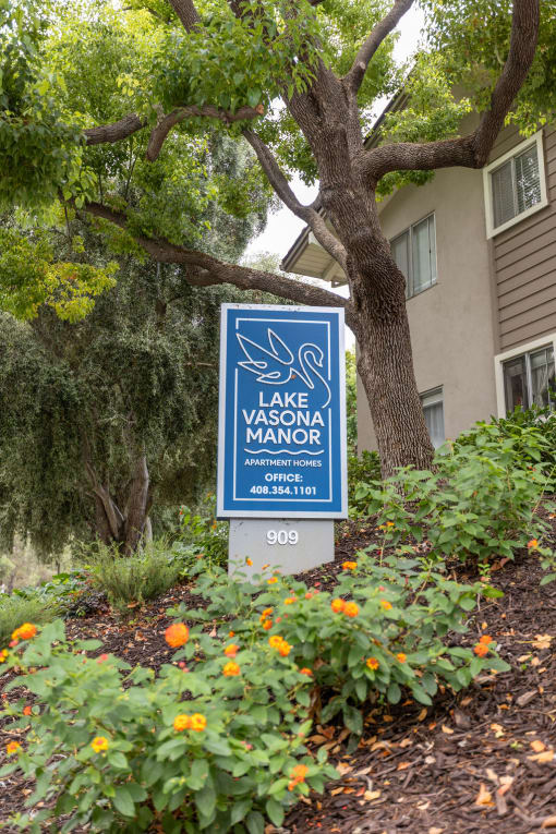 a sign for the lake marina in front of a building