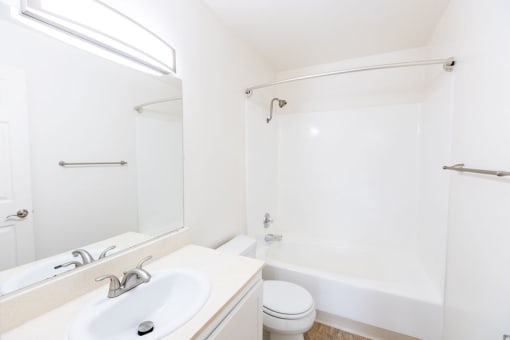 a bathroom with a sink toilet and a shower
