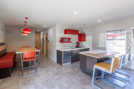 a kitchen and dining area in a hotel room