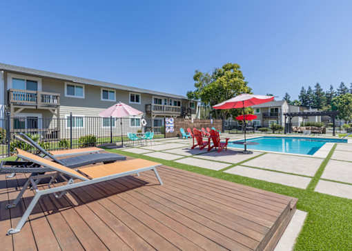 our apartments have a pool and a deck with chairs