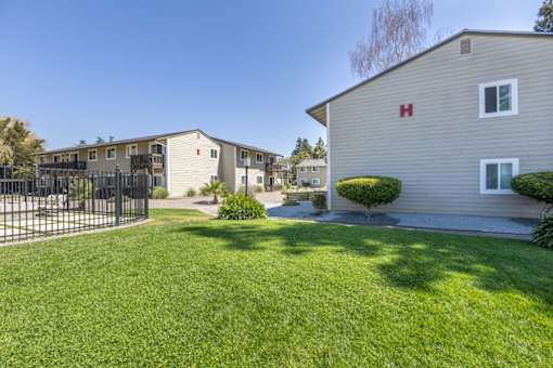 a house with a yard and a fence