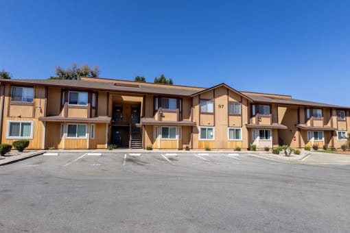 a building with a parking lot in front of it