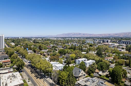 an aerial view of a city with trees and buildings