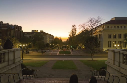 a view of a city square at sunset