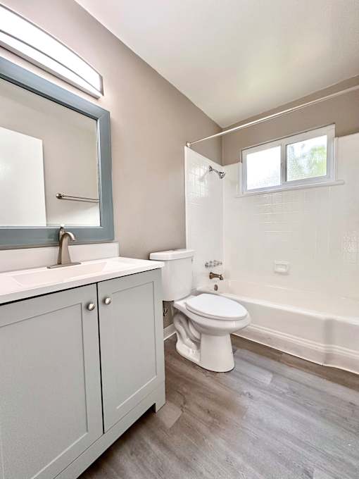an empty bathroom with a toilet and a sink