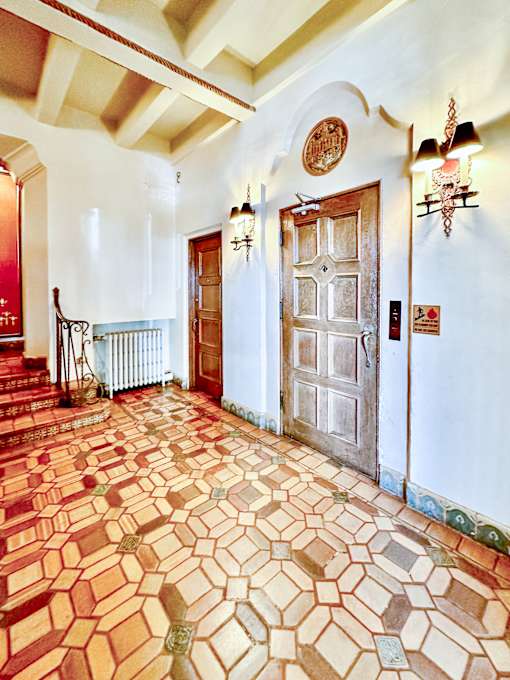 a room with a door and a tile floor