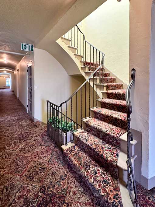the stairs leading up to the lobby of a house