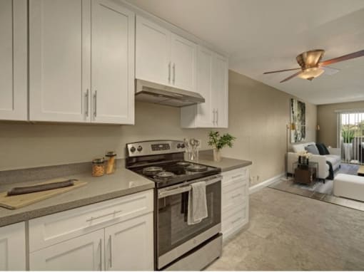 a kitchen with wooden cabinets and stainless steel appliances