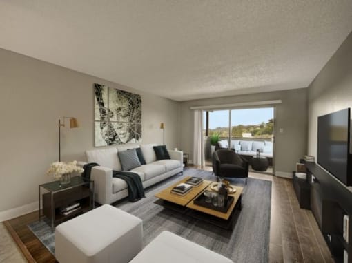 an empty living room with a sliding glass door and a balcony