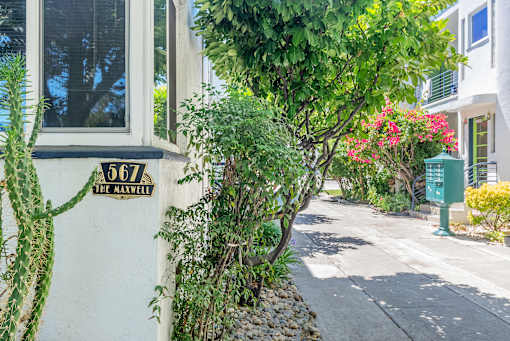 a building with a street sign on the side of it