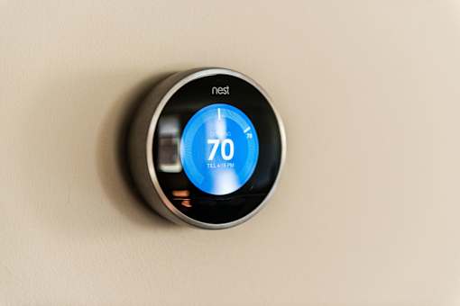A nest thermostat is set to 70 degrees.