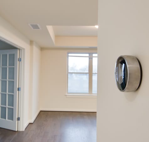 A room with a window and a door.