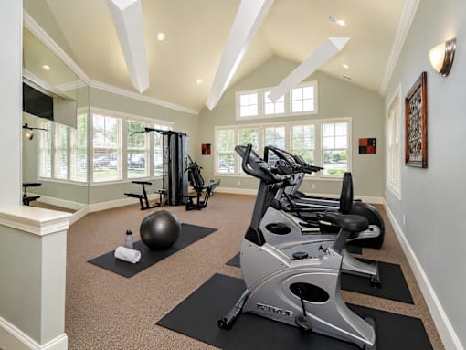 A home gym with a variety of exercise equipment.