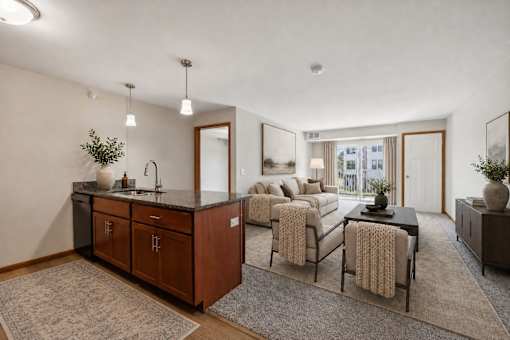 A modern kitchen with a dining area and a living room.