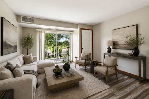 A living room with a large window and a view of the backyard.