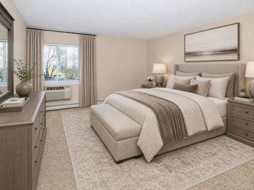 A bedroom with a large bed, a dresser, and a window with curtains.