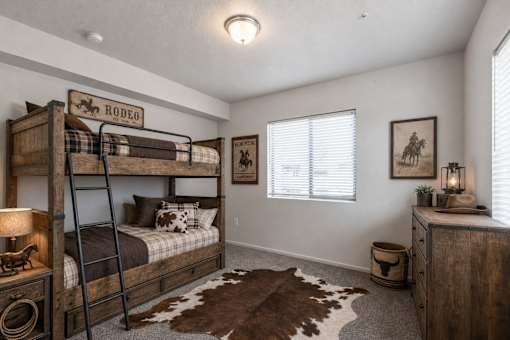 Western themed bedroom with rustic bunk beds at Silver Ridge Apartments, Idaho