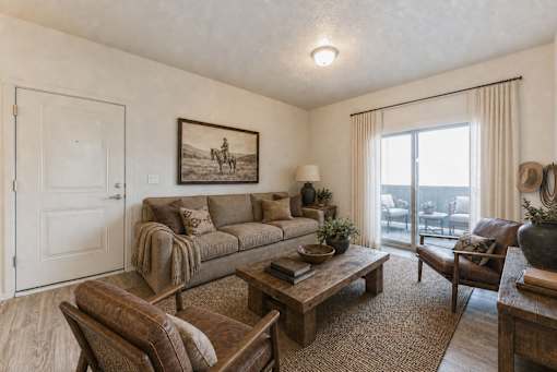 Living room with western artwork and patio access at Silver Ridge Apartments, Meridian, 83642