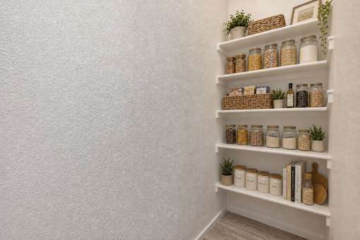 Organized pantry shelves with storage jars and baskets at Silver Ridge Apartments, Idaho, 83642