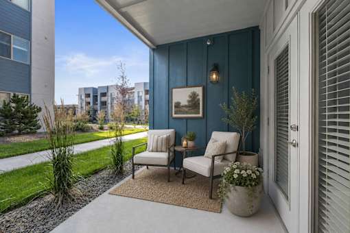 Covered patio with seating and blue accent wall at Silver Ridge Apartments, Meridian, ID 83642