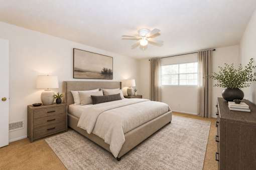 Spacious bedroom with neutral decor and ceiling fan at Stonetree Apartments, East Point, GA 30344