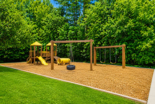 Outdoor playground with swings and play structure at Stonetree Apartments, Georgia, 30344